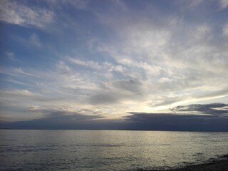 Sea and white clouds in the sunset