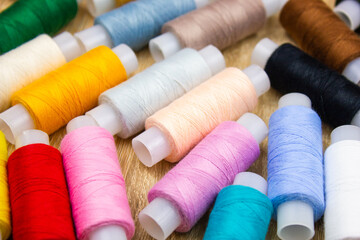 Sewing threads, bobbins, spools of multi-colored sewing threads, tailor.