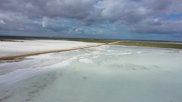 Flying over surface of saline pond. Salt lakes in Guerrero Negro, Mexico