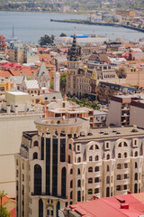 Batumi city in Georgia. City view to skyscrapers, sea and mountains. Houses and hotels. Buildings and landmarks. Black Sea coast. 
