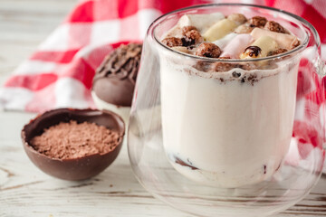 Chocolate bomb with cocoa powder and mini marshmallow to prepare a fragrant hot drink. Process of cooking.