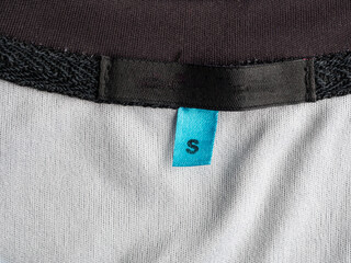 The emblem is missing from the clothing, an empty tag for the logo, copy space