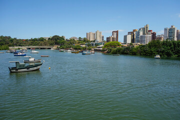 Camburi bridge, at Praia do Canto, in Vitoria, ES, Brazil, and wooden boats on the bay