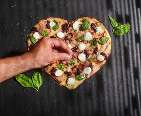 Delicious and crispy heart-shaped red fruit pizza - Served at the table