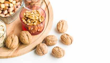 Shelled and unshelled walnuts were selected, on a wooden tray,half and above view