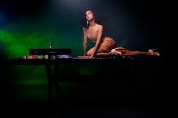 Fototapeta na wymiar Photo of rich naughty poker dealer lady dance stretch on table with neon filter prize for winner in winning game