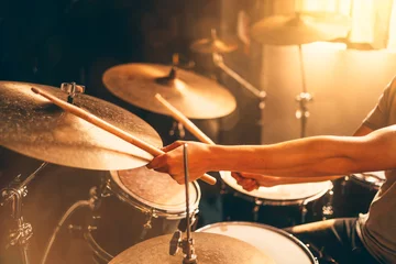 Fotobehang Drummer hands close up. play drums in music studio. © DedMityay