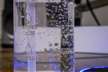 Crystal Clear Water in a Bottle with Bubbles and Condensation - Hydration Concept in a Refreshing Close-Up Shot