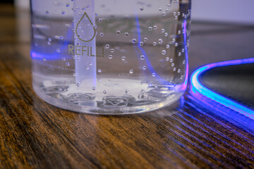 Crystal Clear Water in a Bottle with Bubbles and Condensation - Hydration Concept in a Refreshing Close-Up Shot