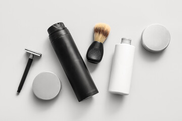 Set of shaving accessories on grey background