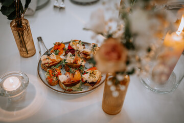 Close-up: canapes. Canapes consist of peperoni, cheese, mozzarella, grapes, olives. Reception, party. Skewers appetizer.