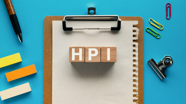 There is wood cube with the word HPI. It is an abbreviation for Human, Performance, Improvement as eye-catching image.