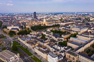 Obraz premium Panoramic aerial view of modern cityscape of Nantes on banks of Loire river on summer day, France