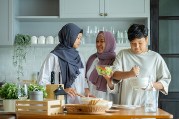 Cute Girl and Son and Her Muslim Mom In Hijab Preparing Pastry For Cookies In Kitchen, Baking...