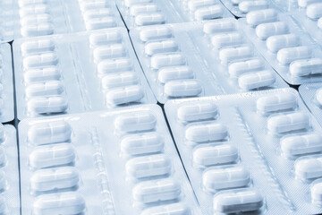 white packaged pills with white light