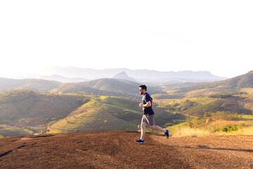 Brazilian man running outdoors amid a beautiful landscape. An image to inspire sports and wellness....