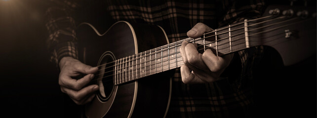Obraz na płótnie Canvas アコースティックギターを弾くミュージシャン