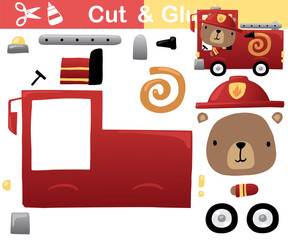 Vector illustration of cute bear cartoon on fire truck. Education paper game for kids. Cut and glue