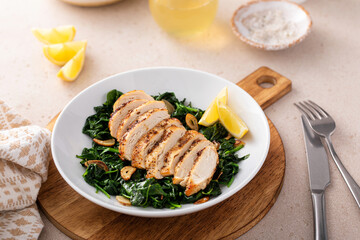 Grilled chicken served with sauteed spinach with garlic