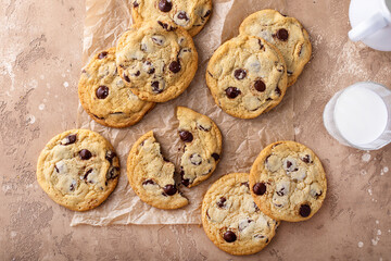 Chocolate chip cookies freshly baked on parchment paper