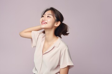 Fototapeta premium Portrait of a joyful fictional Korean woman smiling. Graceful and elegant lady. Natural beauty. Happiness. Isolated on a plain colored pastel background. Generative AI.