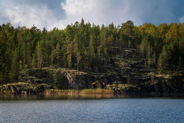 Naklejka premium Lake Ladoga near the village Lumivaara on a sunny autumn day, Ladoga skerries, Lakhdenpokhya, Republic of Karelia, Russia