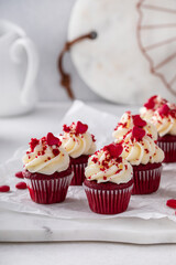 Red velvet cupcakes with cream cheese frosting for Valentines day