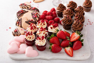 Dessert charcuterie board for Valentines day served with champagne