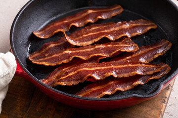 Turkey bacon cooked in a cast iron pan