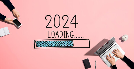 Loading new year 2024 with people working together with laptop and phone