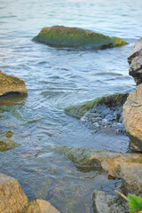 Water flowing around rocks at beach