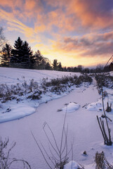 Frozen ravine during sunset in the winter