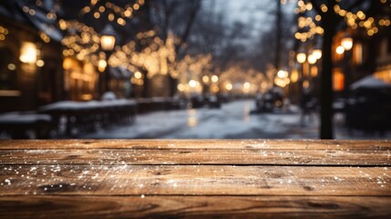 Wooden table covered with snow Empty space with an illuminated Christmas town square. Generative AI.
