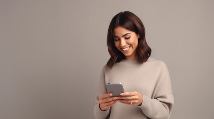 Fototapeta premium Happy Woman Using a Phone Isolated on the Minimalist Background 