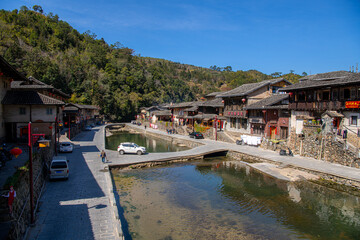 The small houses in the Tuxi village around Tulou clusters and the river