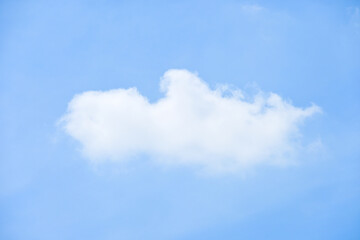 beautiful blue sky and white fluffy single cloud with sunrise in the morning, natural background
