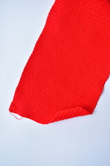 red wool knitted yarn texture, woolen fabric on white background