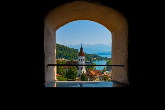 Window View over City of Thun and Lake Thun with Mountain and a Church in a Sunny Day in Thun, Bernese Oberland, Bern Canton, Switzerland, Europe