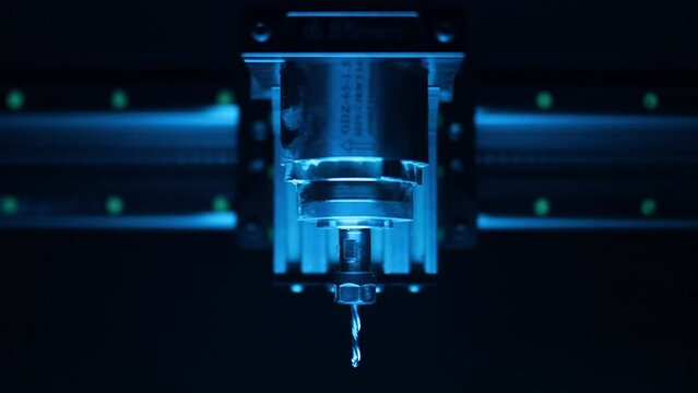 cnc router, spindle, stepper motors, close-up, dark background, blurred