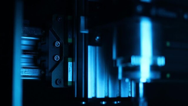 cnc router, spindle, stepper motors, close-up, dark background, blurred