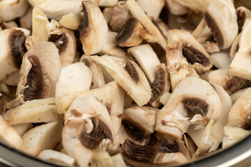 sliced white mushrooms mushrooms during cooking