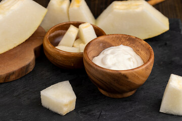 yogurt with melon flavor and ripe and delicious melon close-up
