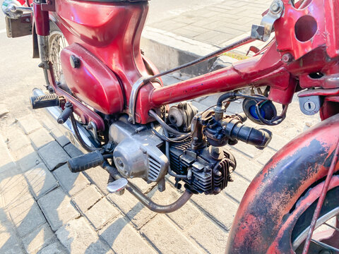 Yogyakarta, Indonesia - November 8, 2023: Honda Super Cub (or Honda Cub) is a Honda underbone motorcycle with a four-stroke single-cylinder engine.  Honda Pitung or Super Cub C70.