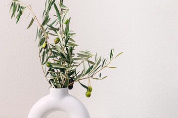 Close-up of olive branches in the vase - obrazy, fototapety, plakaty