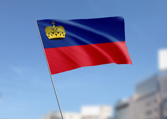 Obraz premium Liechtenstein flag waving in the wind.
