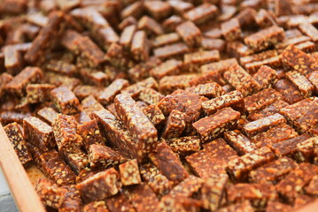 Chocolates are laid out in a row. Factory