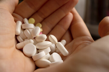 a handful of pills in hands