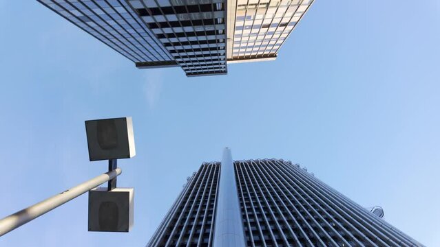 Steel and glass skyscraper buildings in Madrid's financial district on a sunny day, Spain.