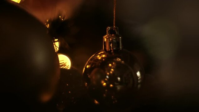 Dark key, Christmas tree background with golden ball. Christmas and New Year decoration.