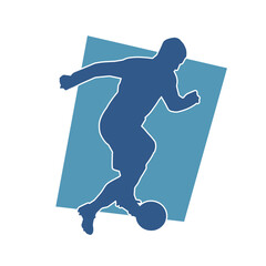 Silhouette of a man playing soccer. Silhouette of a football player in action pose.